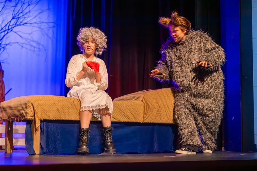  Students performing dressed and big bad wolf and old grandma